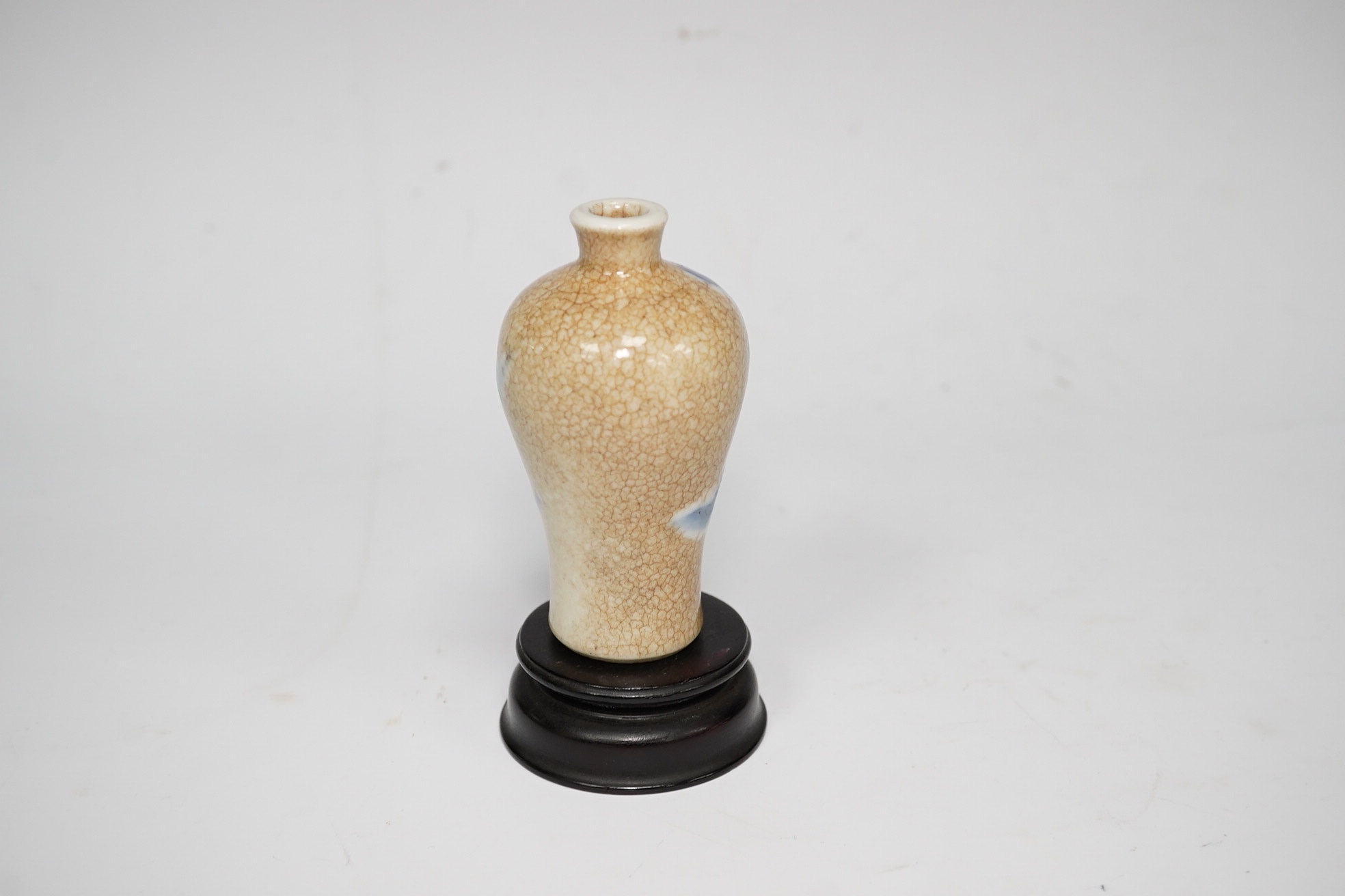 A Chinese blue and white crackle glaze snuff bottle, late 19th century and stand, 8cm high. Condition - good